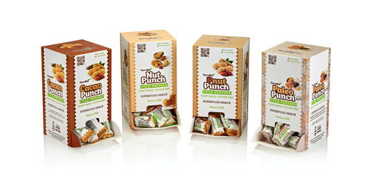 A complete set of four TerraNut Gravity Box dispensers featuring Cacao Punch, Nut Punch, Pnut Punch, and Paleo Punch with Açaí flavors, all showcasing cold-pressed and plant-based ingredients.