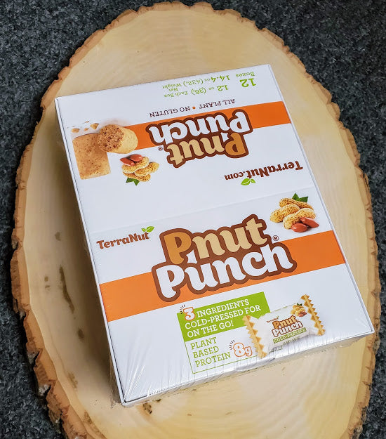 Behind-the-scenes photo of TerraNut Pnut Punch cold-pressed snack bars during production.